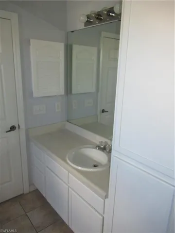 a bathroom with a bathtub and window