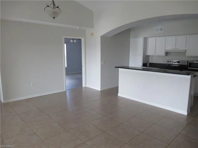a view of a kitchen with a sink cabinets and a window