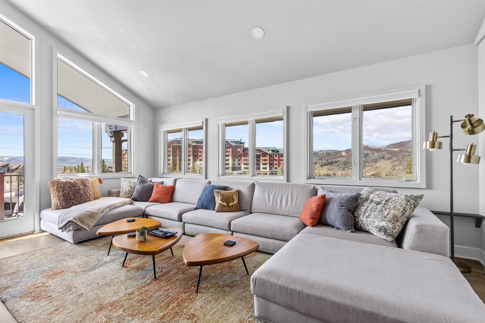 1724 Ski Time Square Drive, Unit R6 Steamboat Springs, CO 80487 - Photo 4 of 39 a living room with furniture and a large window