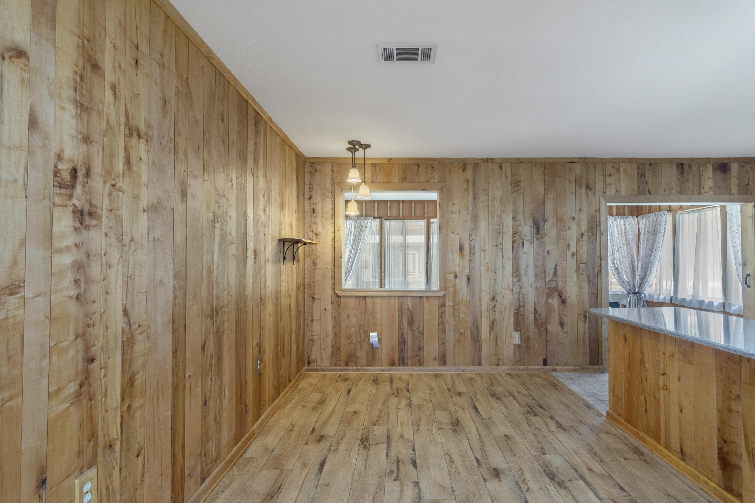 5489 Highway 4 Baker, FL 32531 - Photo 14 of 65 a view of a hallway with wooden floor and staircase