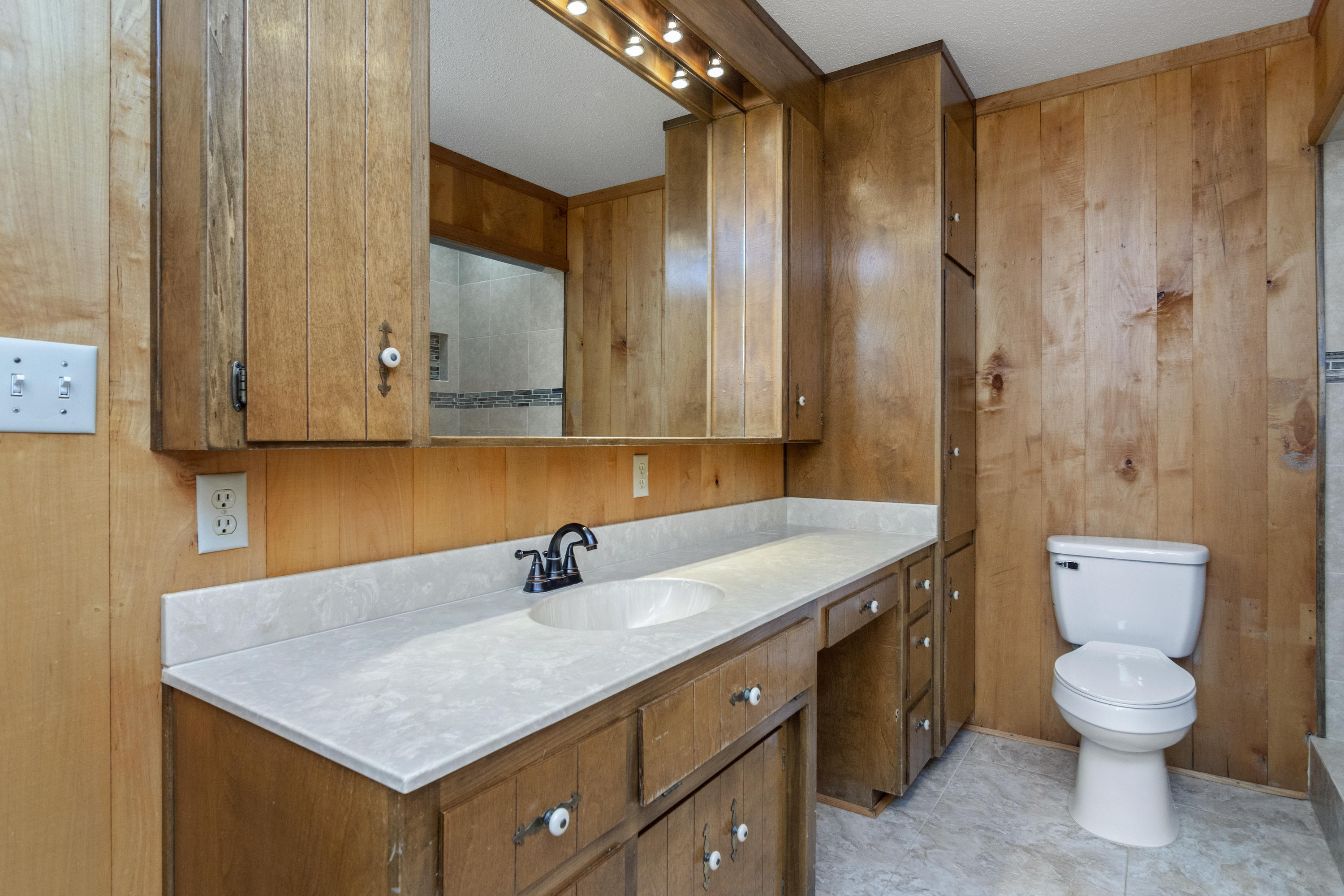 5489 Highway 4 Baker, FL 32531 - Photo 17 of 65 a bathroom with a sink a toilet and shower