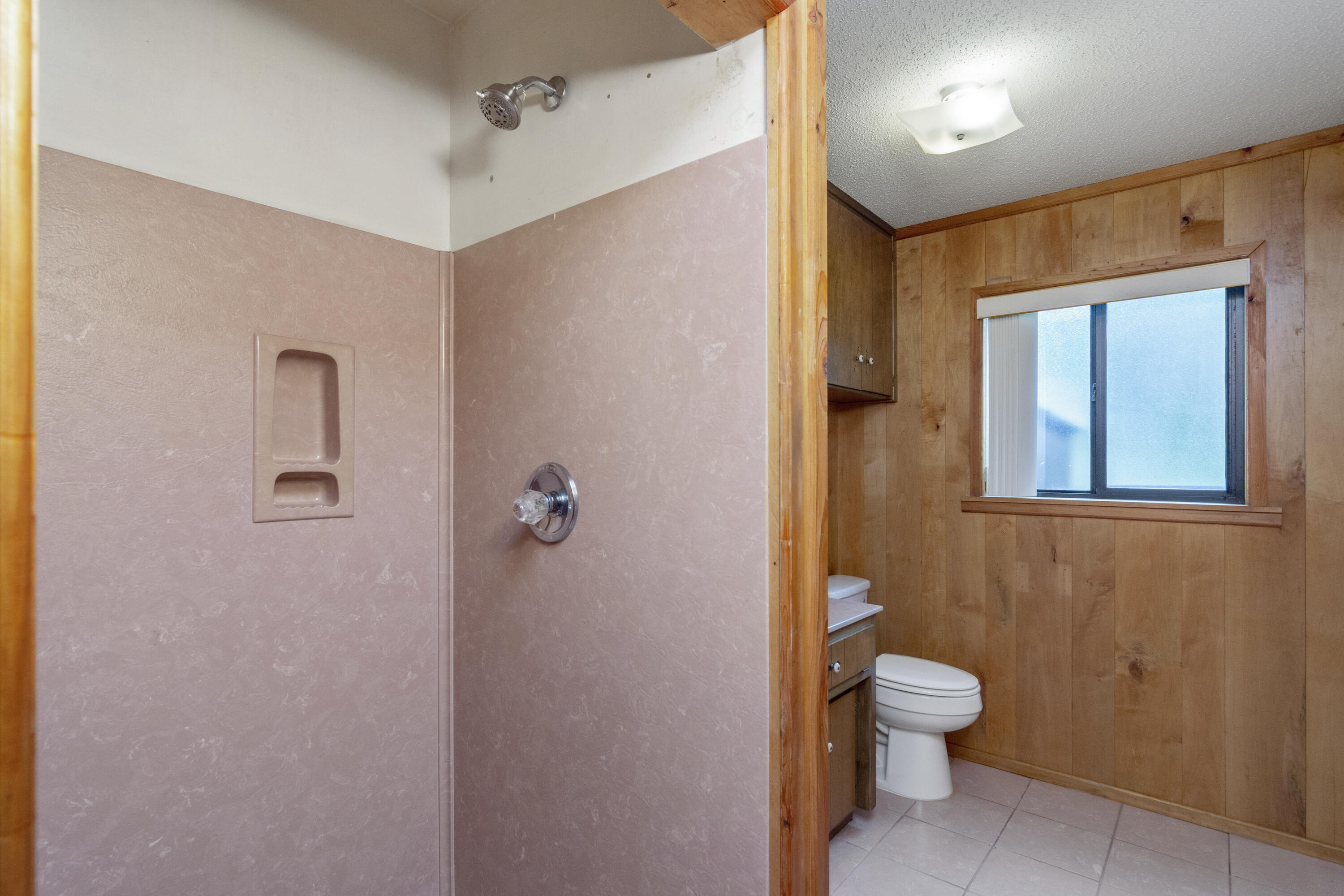 5489 Highway 4 Baker, FL 32531 - Photo 24 of 65 a white toilet sitting next to a bathroom sink