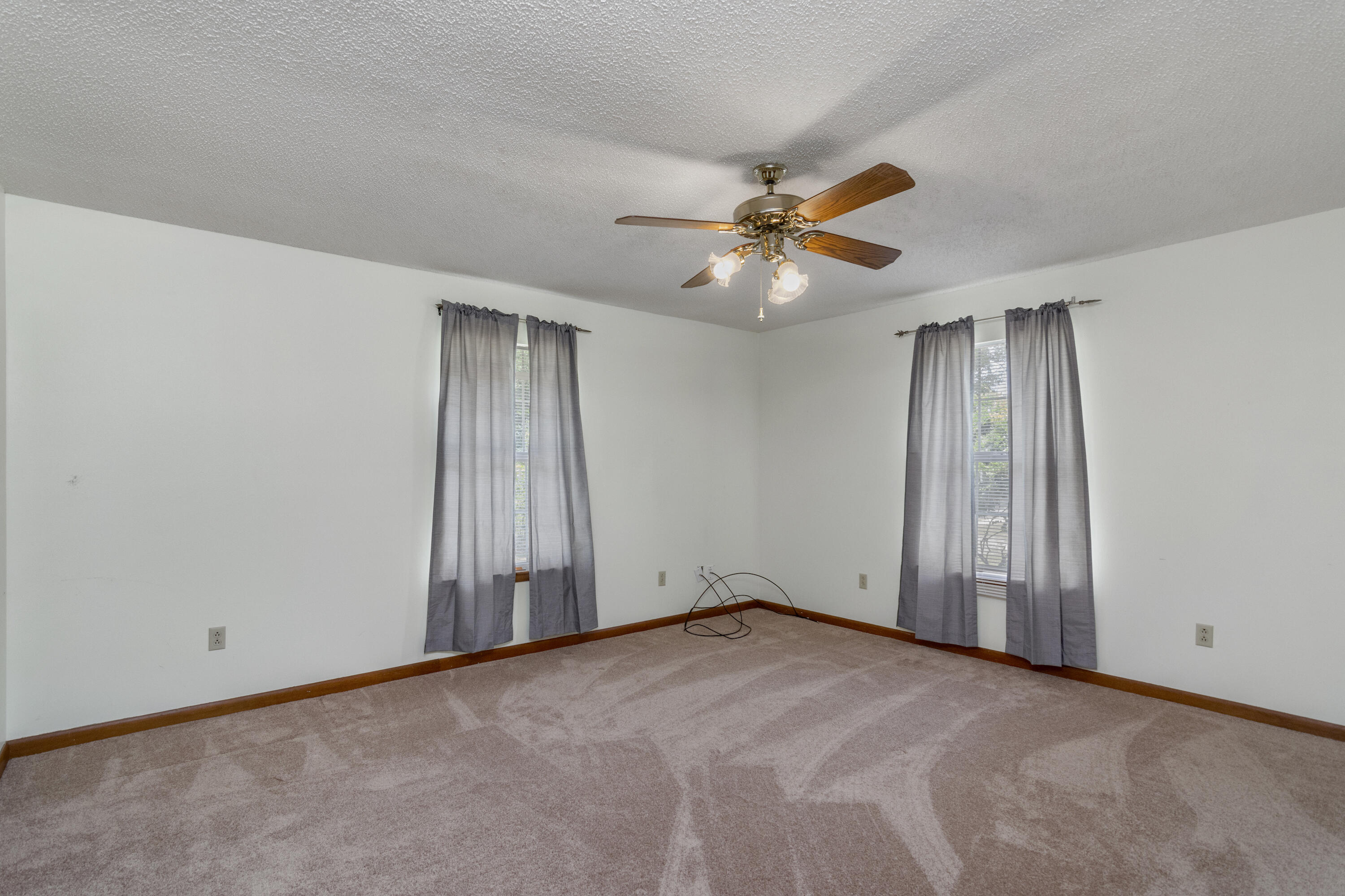 5489 Highway 4 Baker, FL 32531 - Photo 40 of 65 an empty room with windows and fan