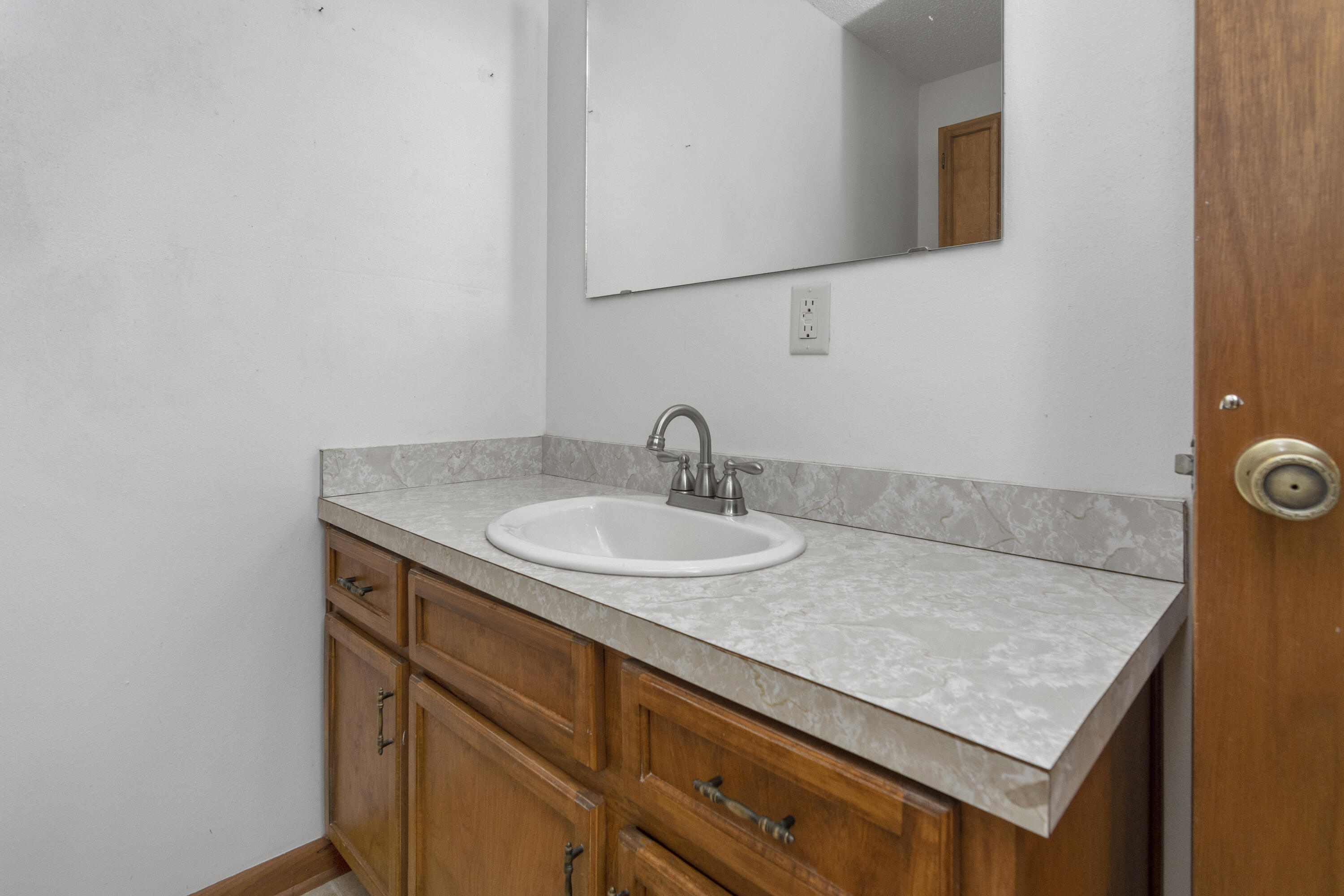 5489 Highway 4 Baker, FL 32531 - Photo 42 of 65 a bathroom with a sink and a mirror