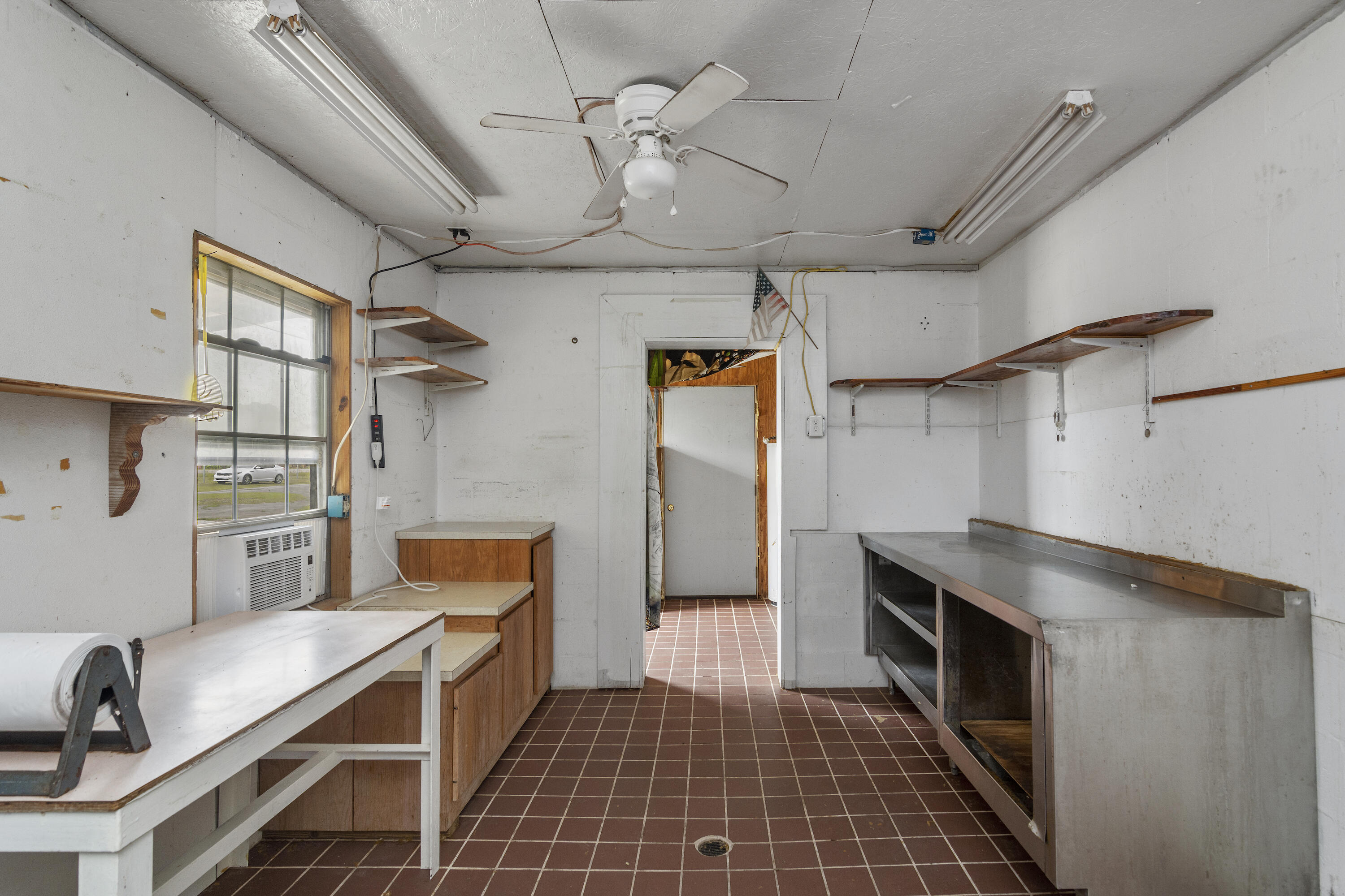 5489 Highway 4 Baker, FL 32531 - Photo 55 of 65 a kitchen with stainless steel appliances a stove a refrigerator and cabinets