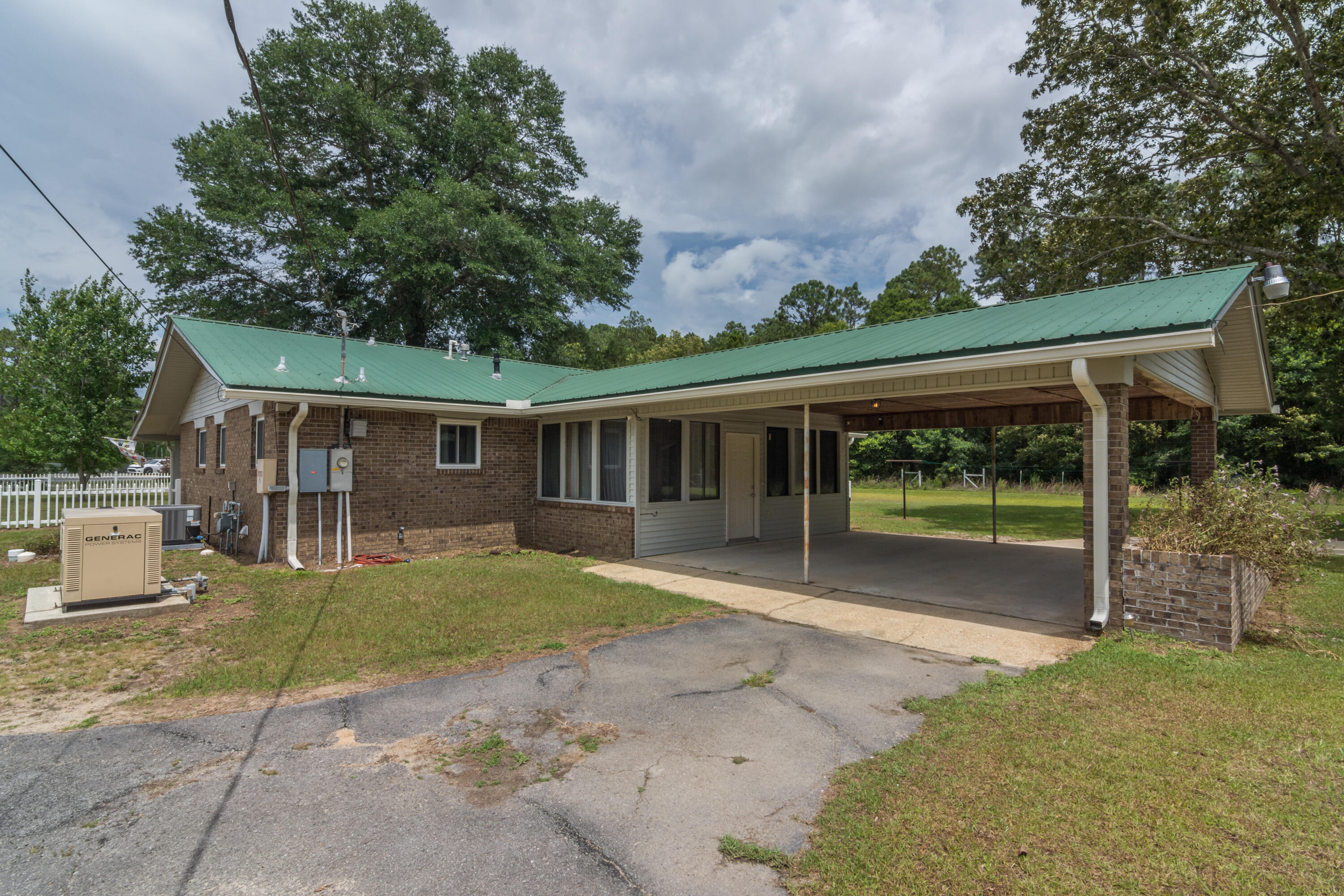 5489 Highway 4 Baker, FL 32531 - Photo 7 of 65 a view of a house with a yard and porch