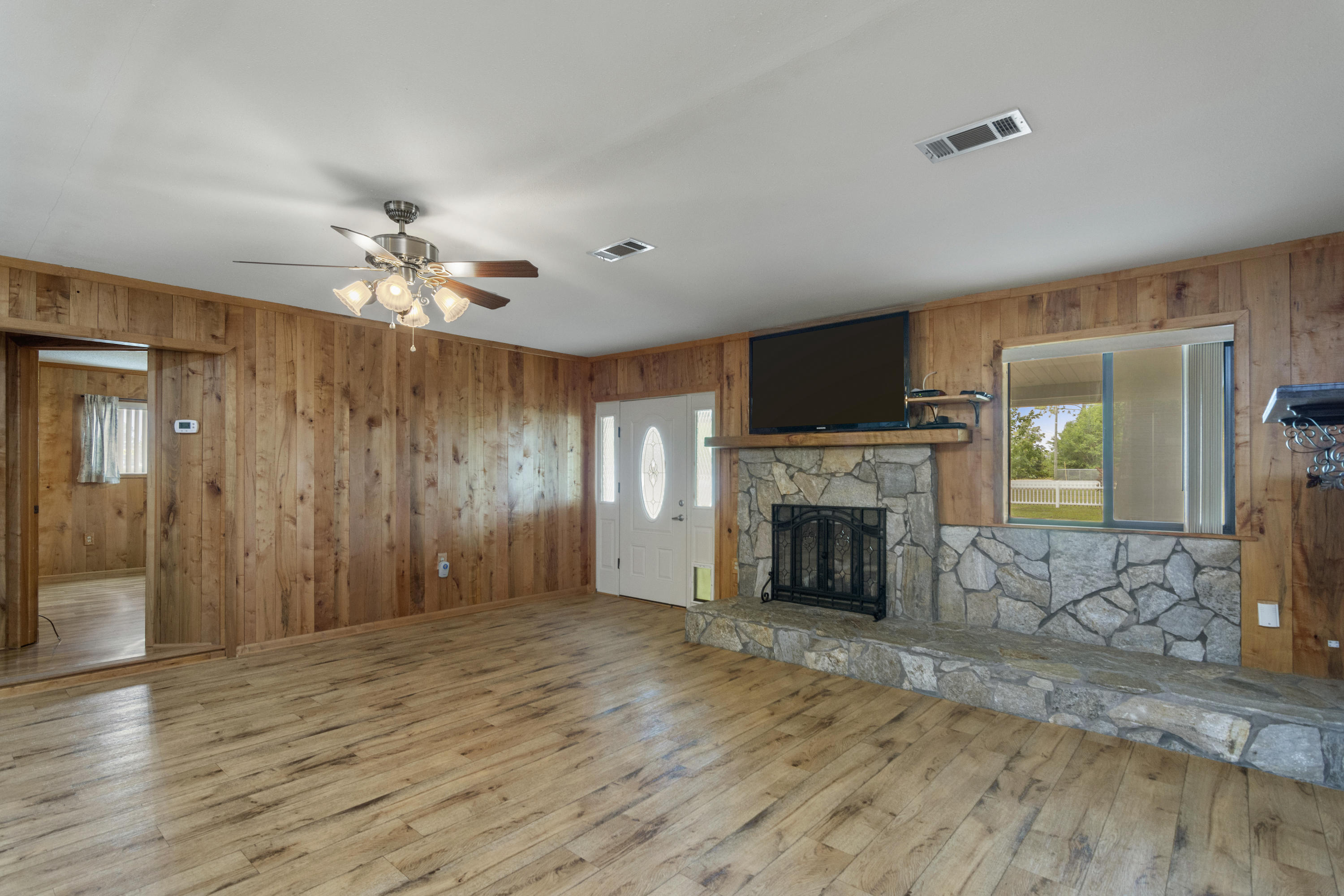 5489 Highway 4 Baker, FL 32531 - Photo 9 of 65 a view of a livingroom with a fireplace and window
