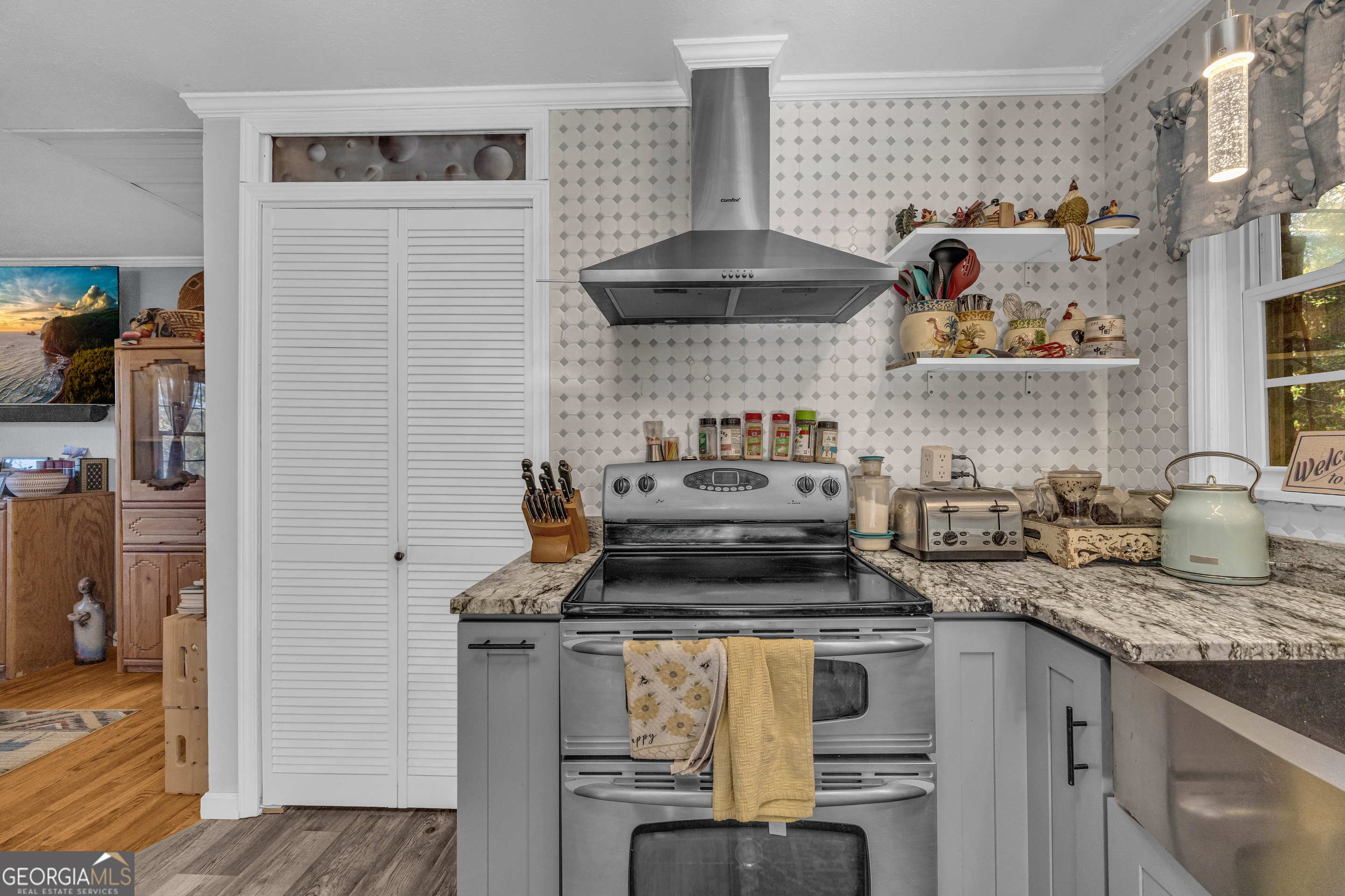 62 Oak Street Elberton, GA 30635 - Photo 11 of 48 a kitchen with stainless steel appliances granite countertop a stove and a sink