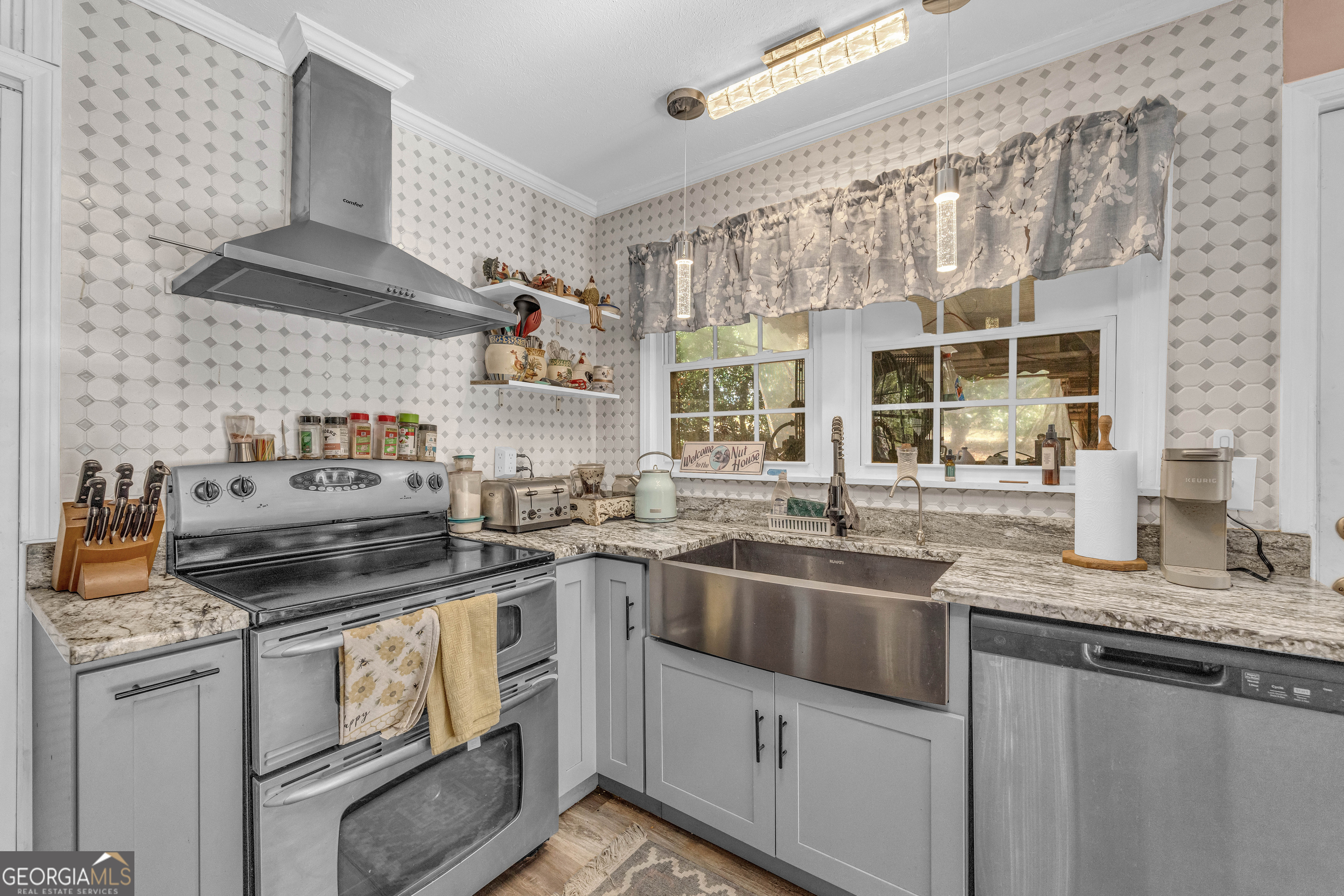 62 Oak Street Elberton, GA 30635 - Photo 12 of 48 a kitchen with stainless steel appliances granite countertop a stove and a sink