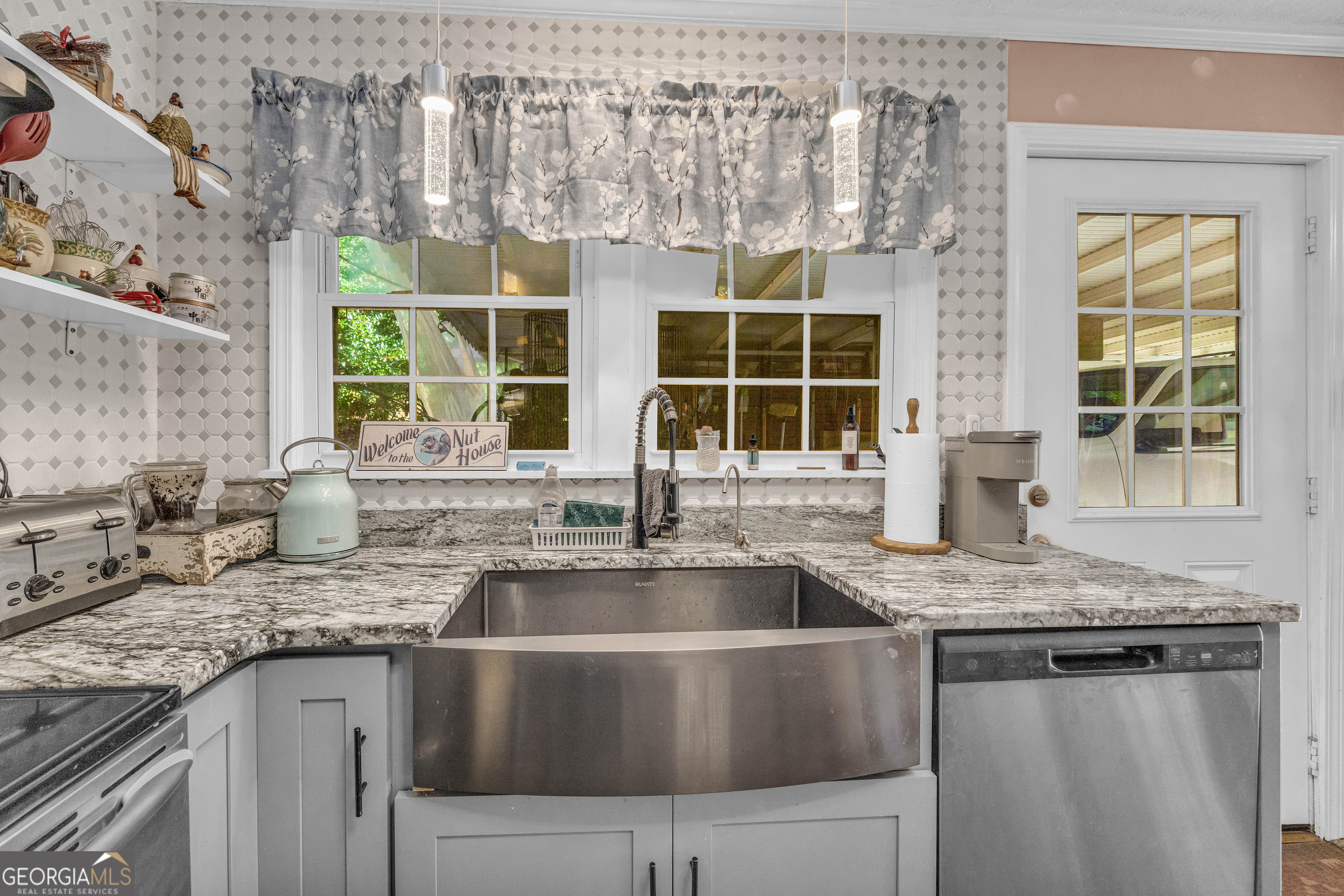62 Oak Street Elberton, GA 30635 - Photo 13 of 48 a kitchen with granite countertop a sink and a window