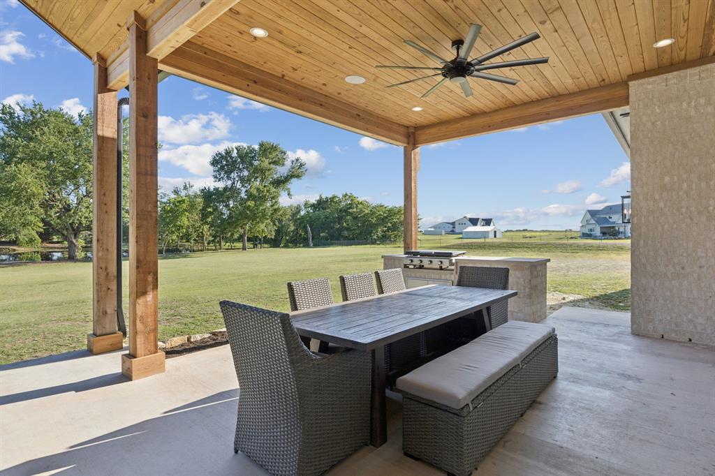 1890 McConnell Road Gunter, TX 75058 - Photo 36 of 40 a outdoor living space with furniture and garden view