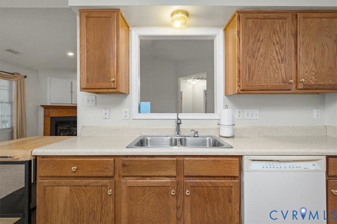 4319 Stately Oak Road North Chesterfield, VA 23234 - Photo 31 of 51 Kitchen featuring wood cabinetry, a double-basin s