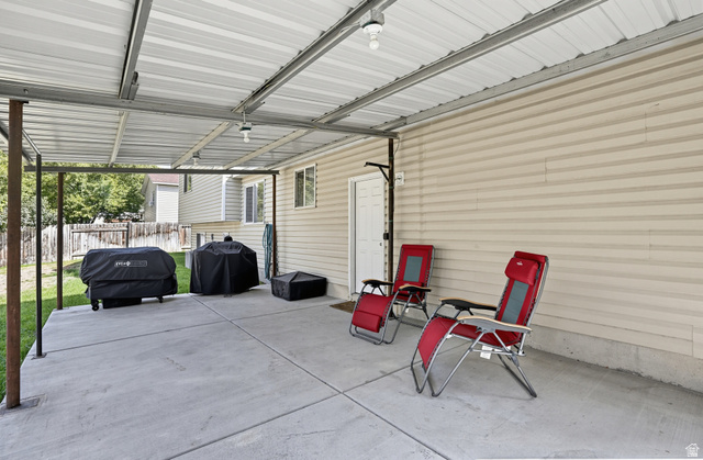 352 West 850 N Street Springville, UT 84663 - Photo 7 of 34 Covered patio featuring a concrete slab and overhead lighting