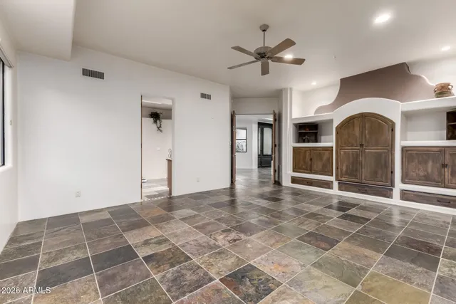 a kitchen with stainless steel appliances a sink and cabinets