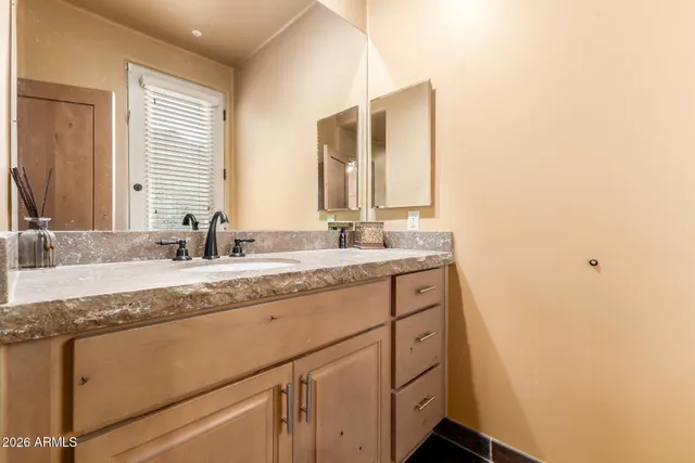 a view of a house with a yard and sitting space