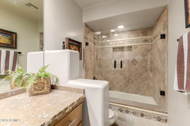 a view of a house with a yard and tree s