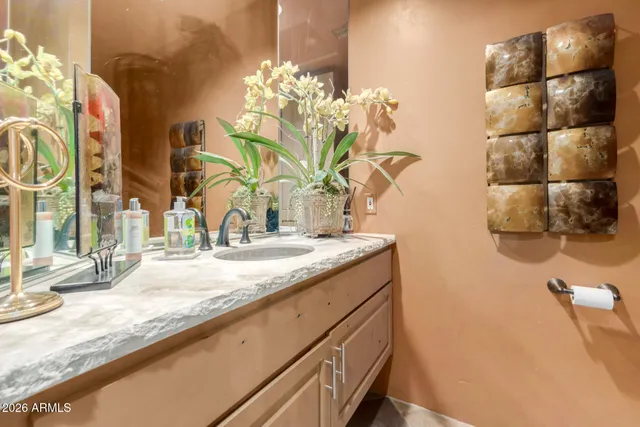 a view of a backyard with plants and patio