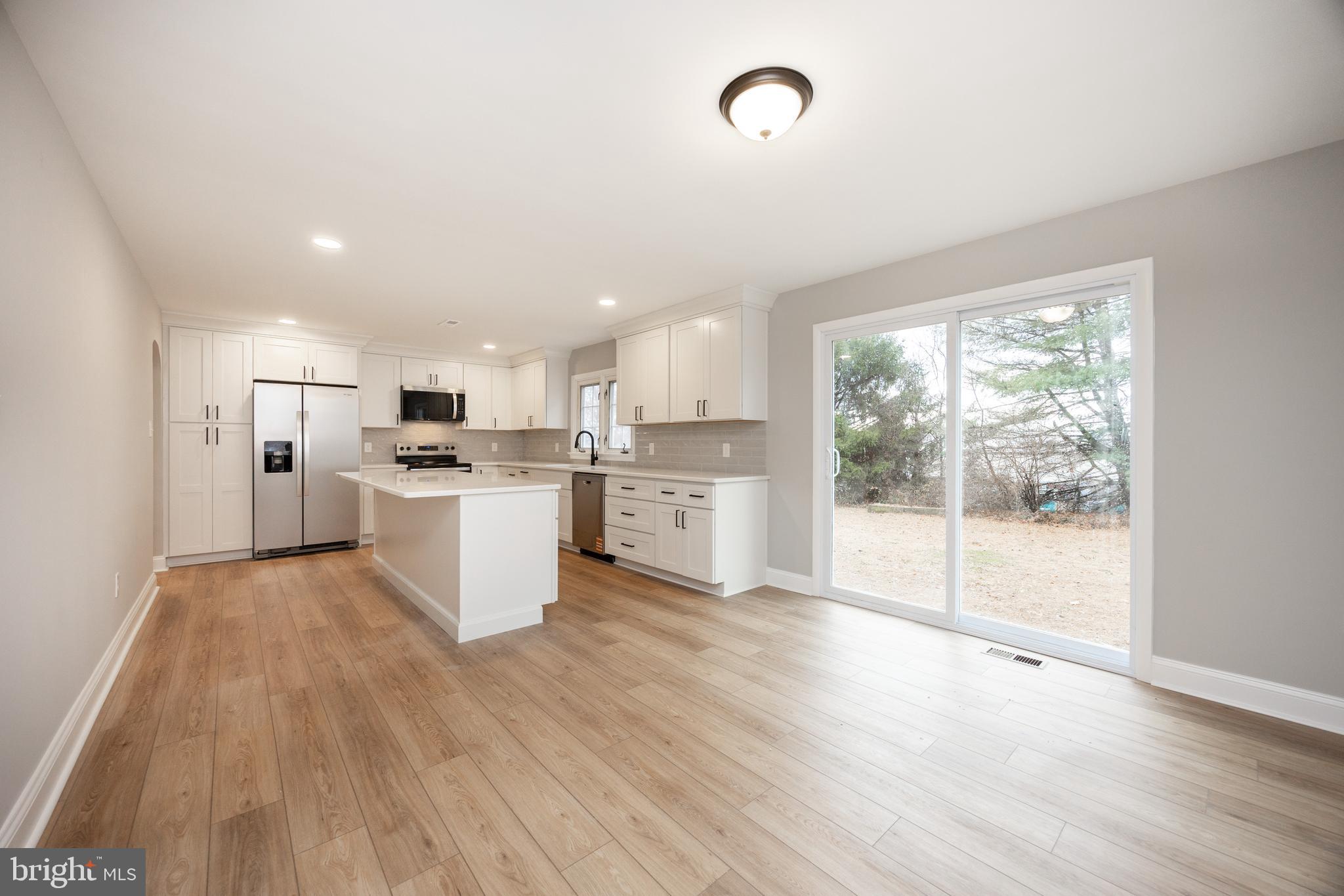 60 Buckwalter Road Royersford, PA 19468 - Photo 11 of 40 a kitchen with white cabinets and white appliances