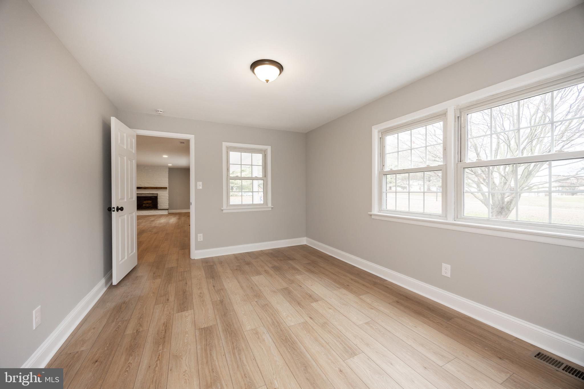 60 Buckwalter Road Royersford, PA 19468 - Photo 17 of 40 a view of empty room with wooden floor and fan