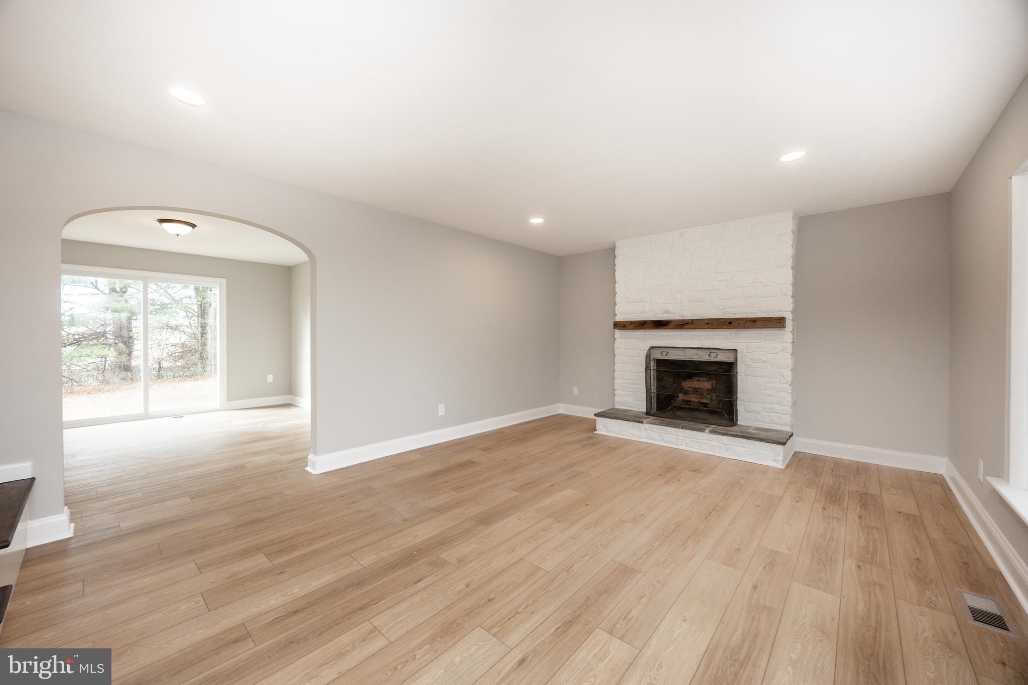 60 Buckwalter Road Royersford, PA 19468 - Photo 5 of 40 an empty room with wooden floor and fireplace