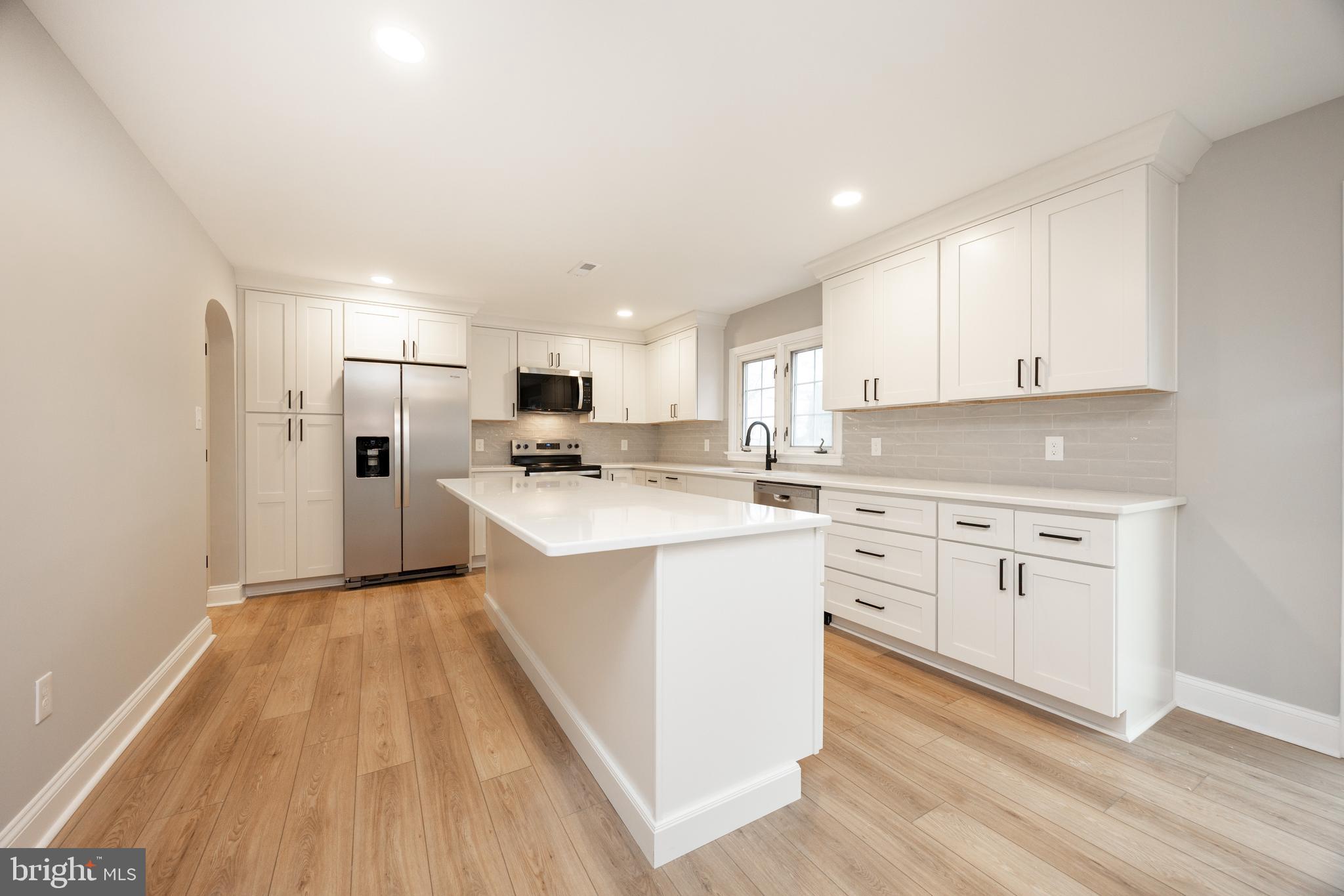 60 Buckwalter Road Royersford, PA 19468 - Photo 7 of 40 a kitchen with cabinets oven and a dishwasher with wooden floor