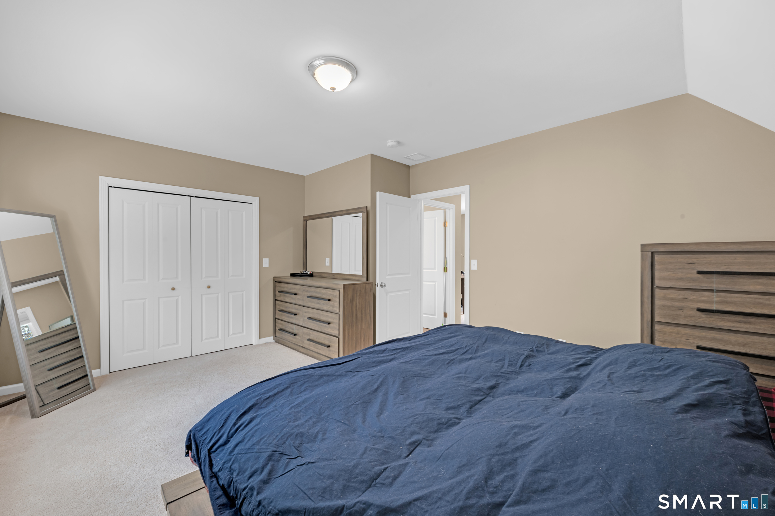123 Ashford Road, Unit 1 Eastford, CT 06242 - Photo 15 of 23 a bedroom with a bed and a television