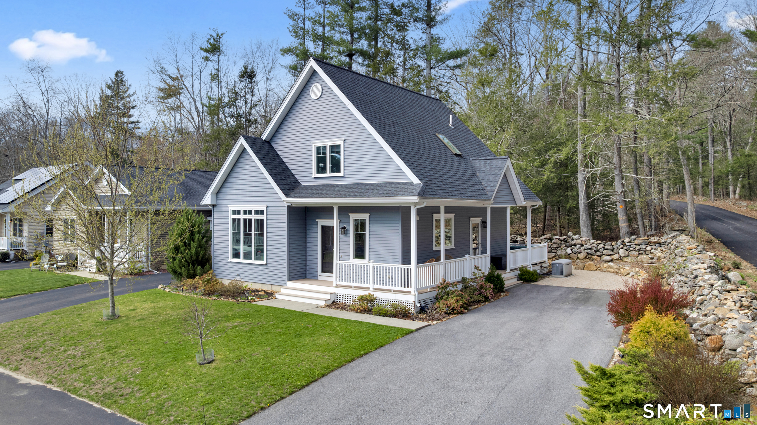 123 Ashford Road, Unit 1 Eastford, CT 06242 - Photo 2 of 23 front view of a house with a yard