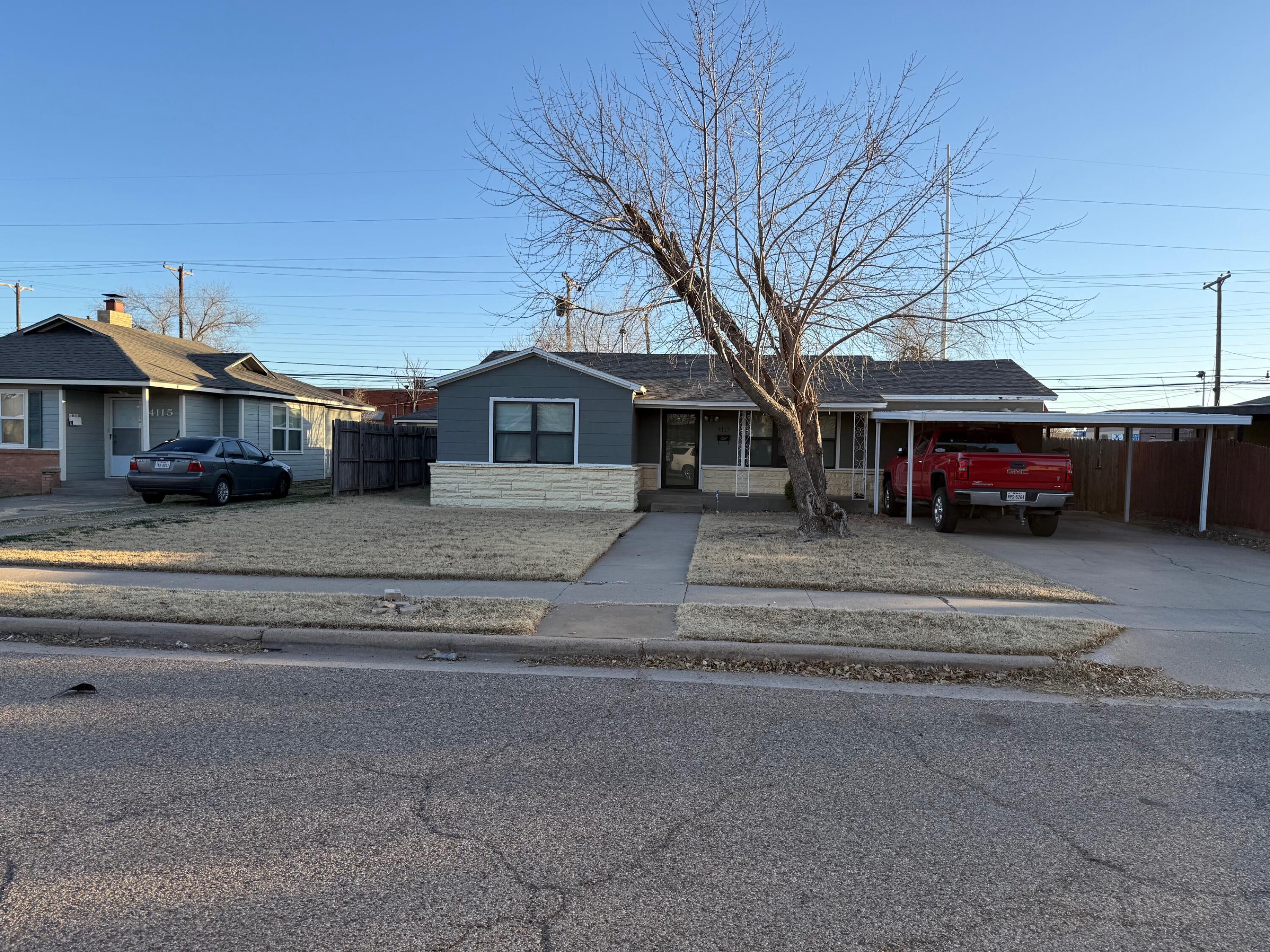 4117 33rd Street Lubbock, TX 79410 - Photo 2 of 14 a front view of a house with a yard