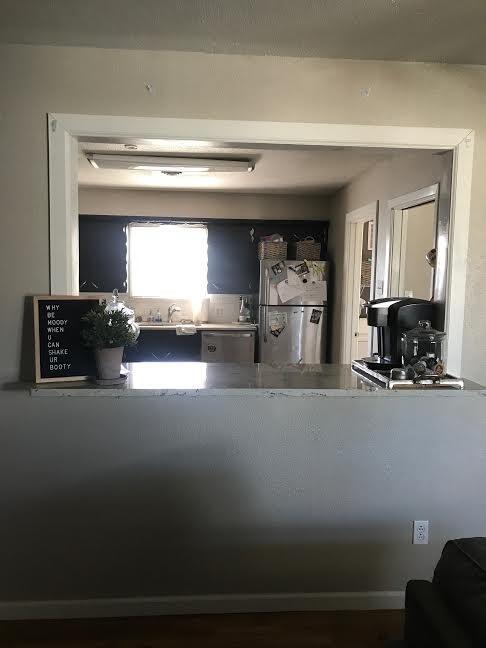 4117 33rd Street Lubbock, TX 79410 - Photo 4 of 14 a living room with furniture and a fireplace