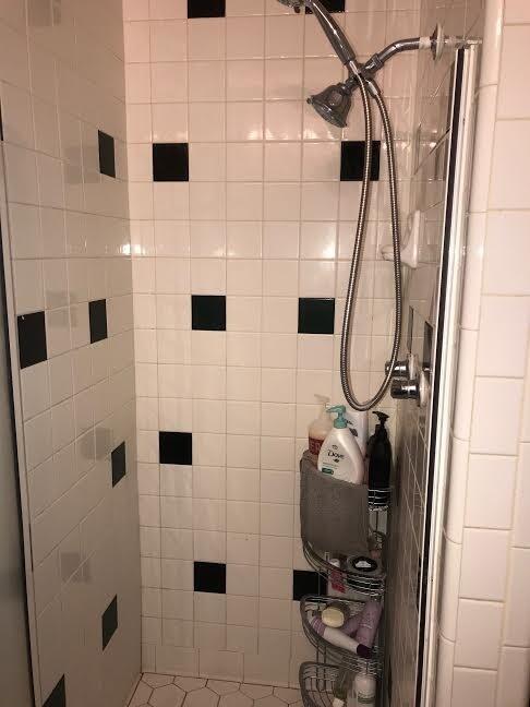 4117 33rd Street Lubbock, TX 79410 - Photo 7 of 14 a bathroom with a sink a toilet and shower