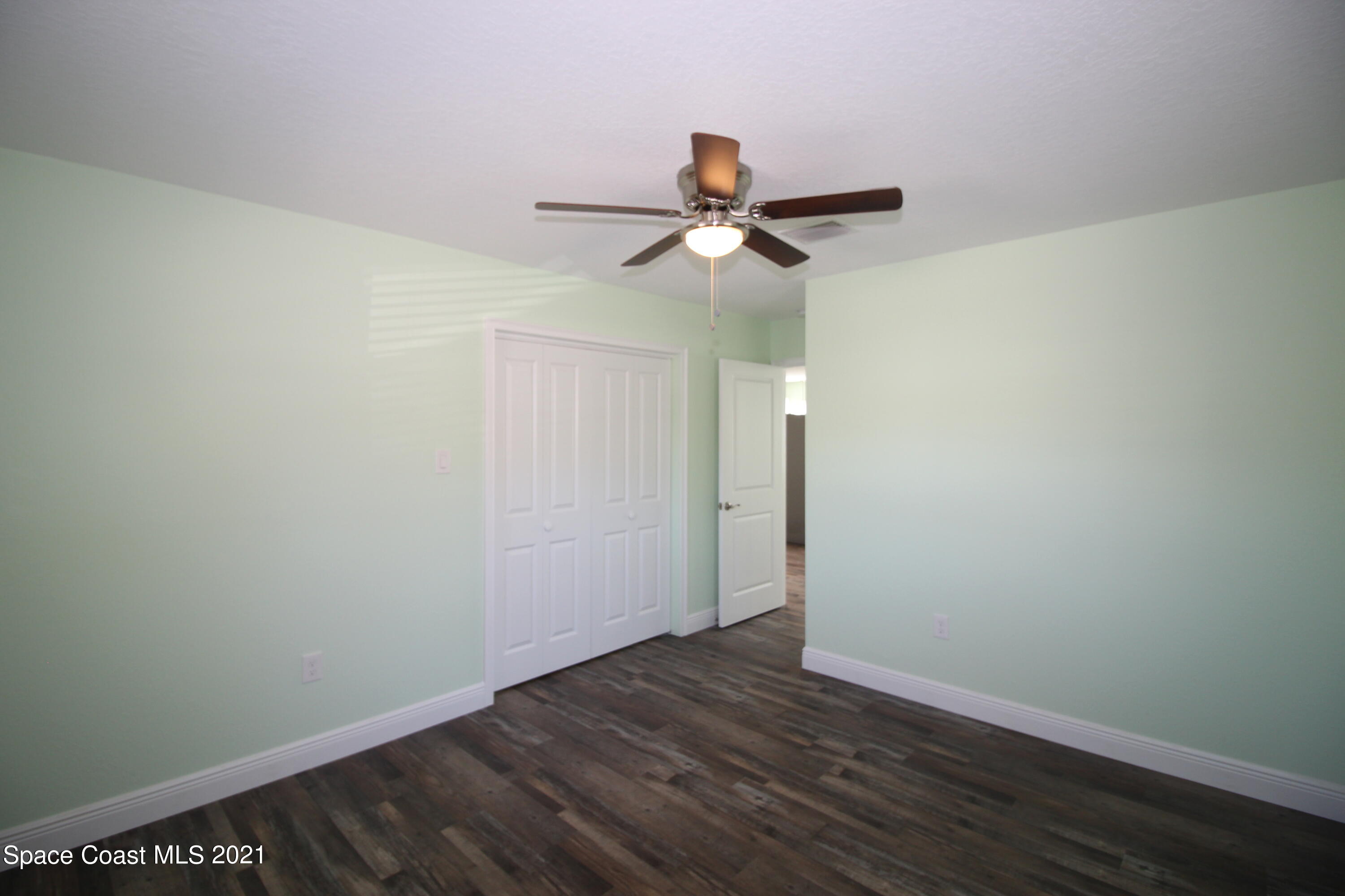 244 North Grove Street Merritt Island, FL 32953 - Photo 11 of 25 a view of a room with wooden floor