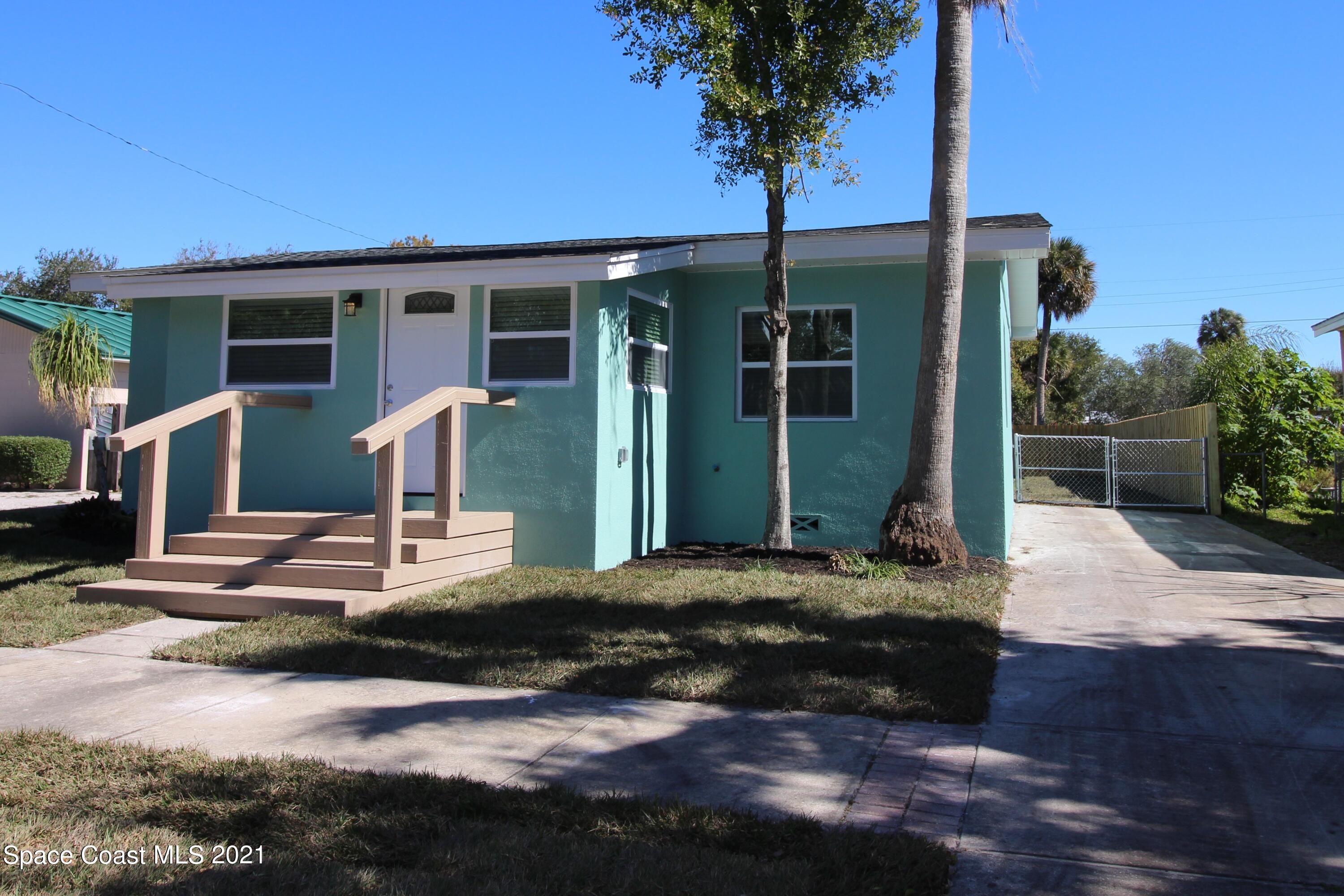 244 North Grove Street Merritt Island, FL 32953 - Photo 24 of 25 a front view of a house with garden
