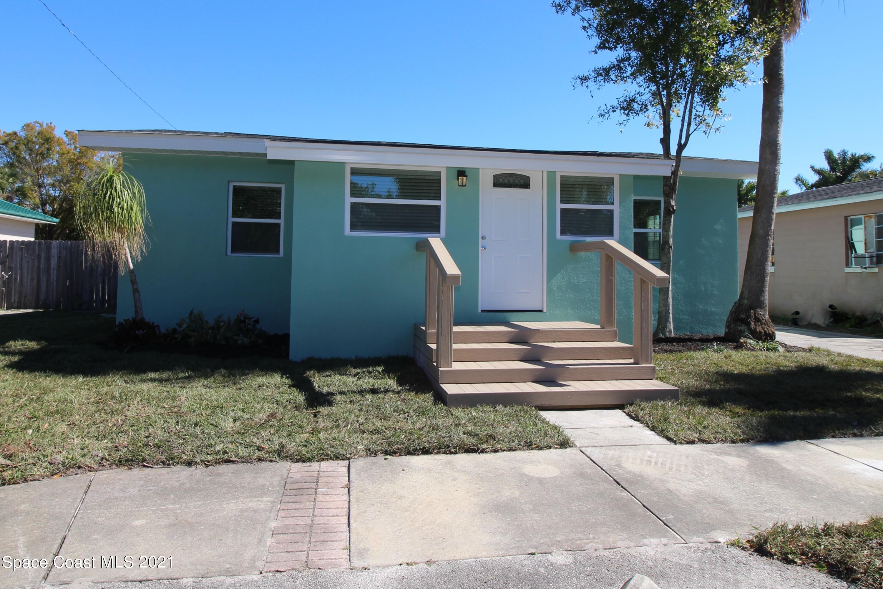 244 North Grove Street Merritt Island, FL 32953 - Photo 25 of 25 a front view of a house with garden