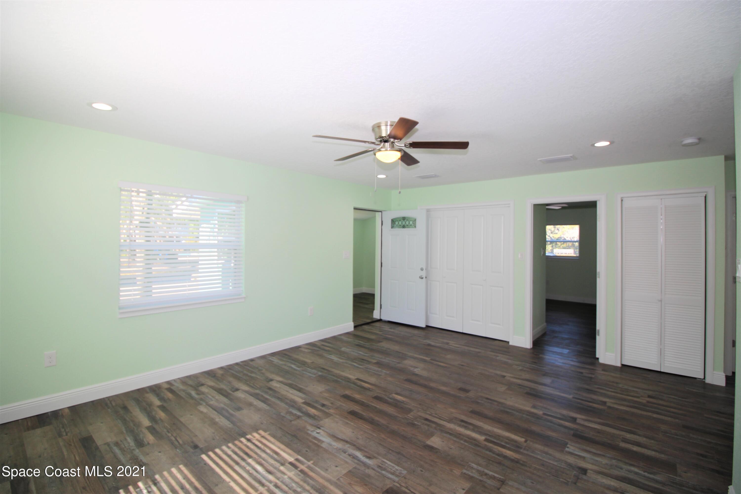 244 North Grove Street Merritt Island, FL 32953 - Photo 4 of 25 a view of an empty room with a window