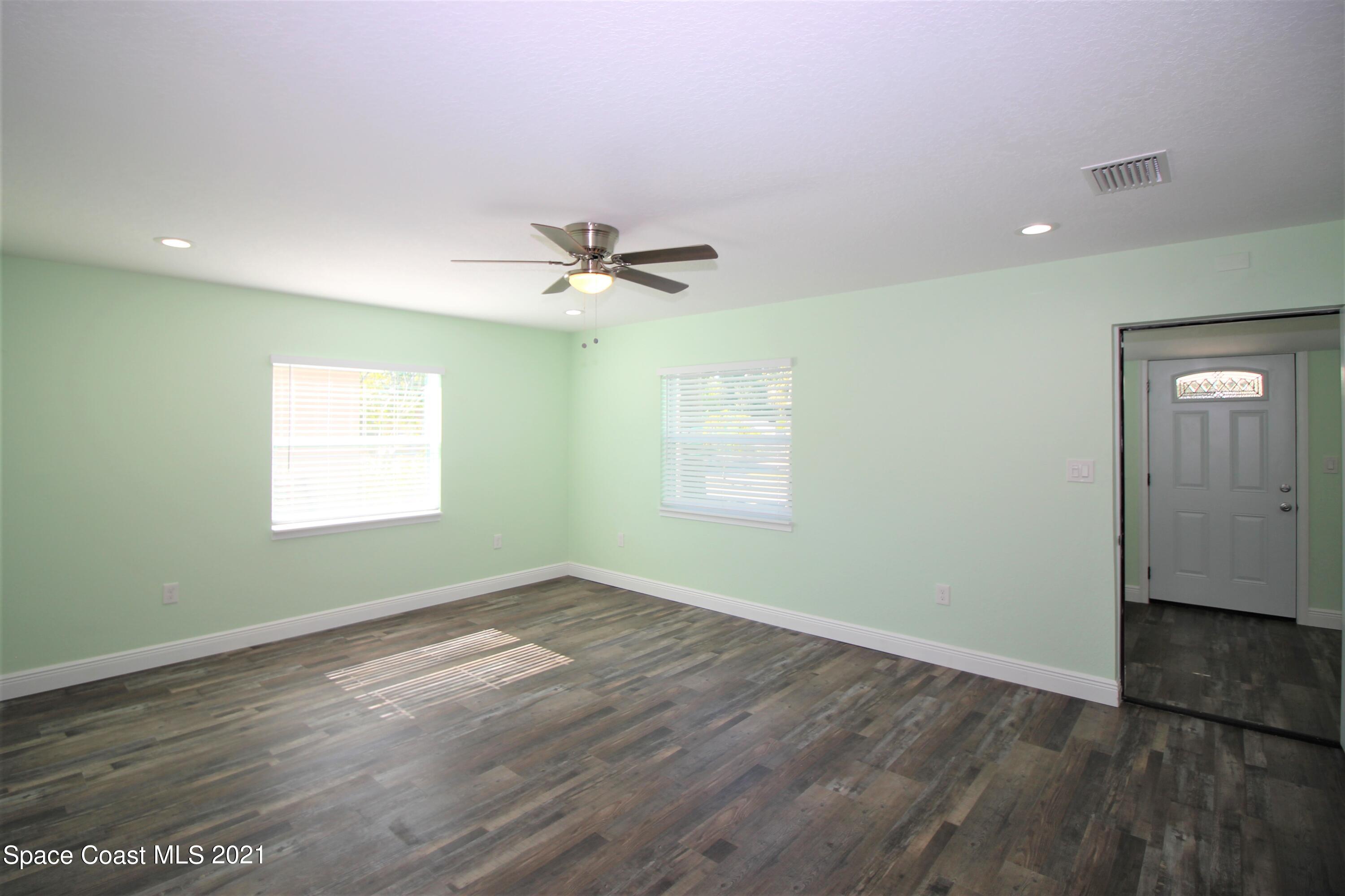 244 North Grove Street Merritt Island, FL 32953 - Photo 5 of 25 wooden floor in an empty room