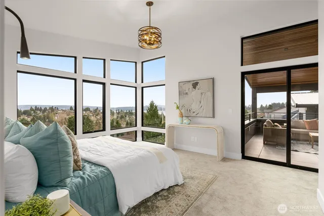 a bed sitting in a bedroom next to a window