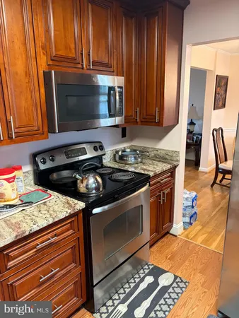 a kitchen with a stove and a microwave