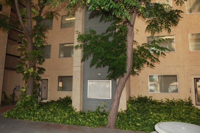 201 North 13th Avenue, Unit 100 Edinburg, TX 78541 - Photo 3 of 6 front view of a house with a garden