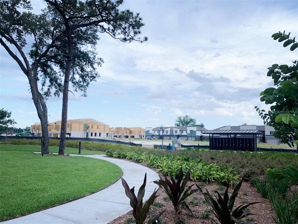 1480 Broad Wing Lane Winter Park, FL 32792 - Photo 15 of 17 a view of a garden with a bench in the garden