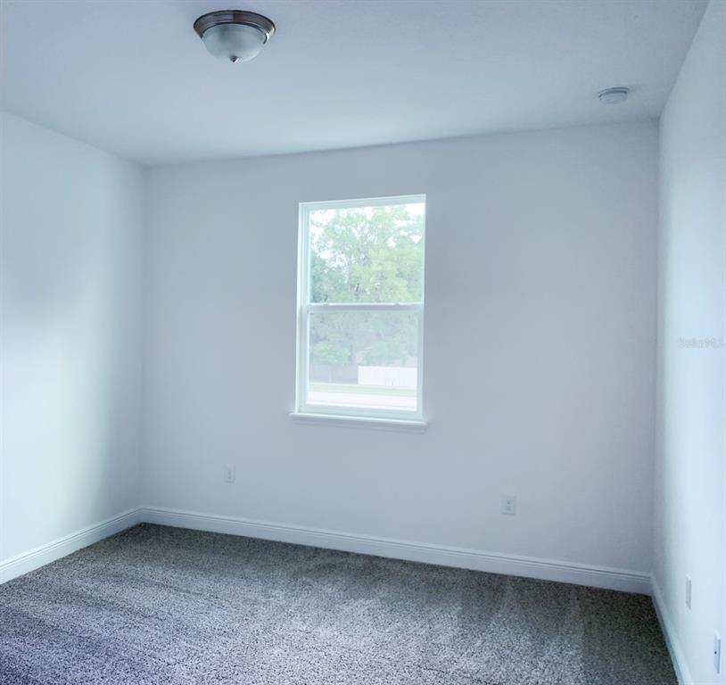 1480 Broad Wing Lane Winter Park, FL 32792 - Photo 8 of 17 an empty room with a window