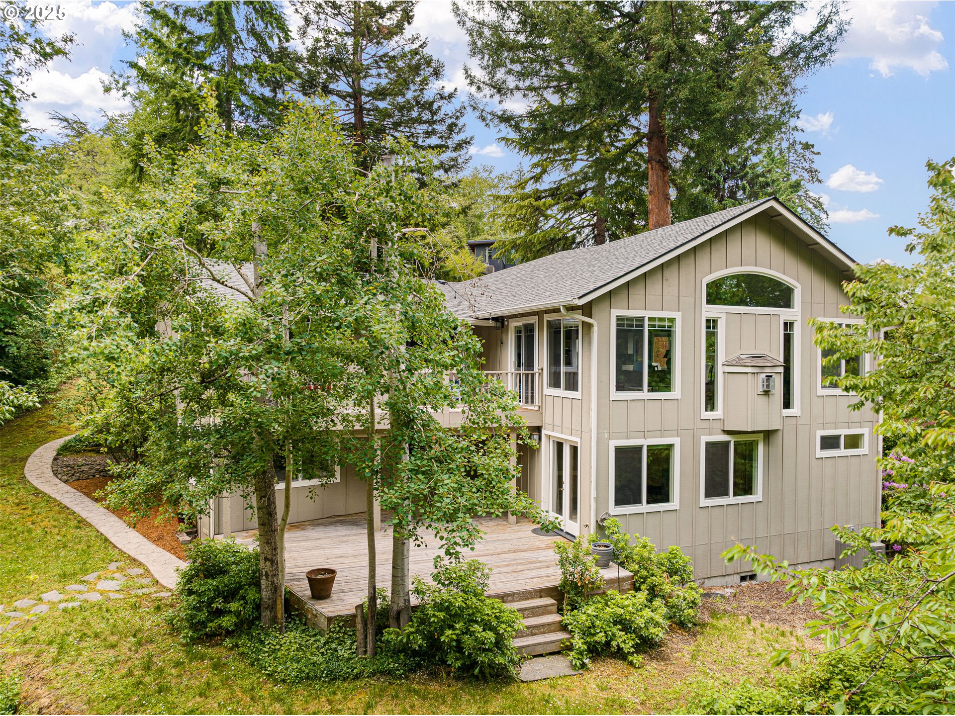 2977 Ingalls Way Eugene, OR 97405 - Photo 3 of 48 a front view of a house with a yard and trees