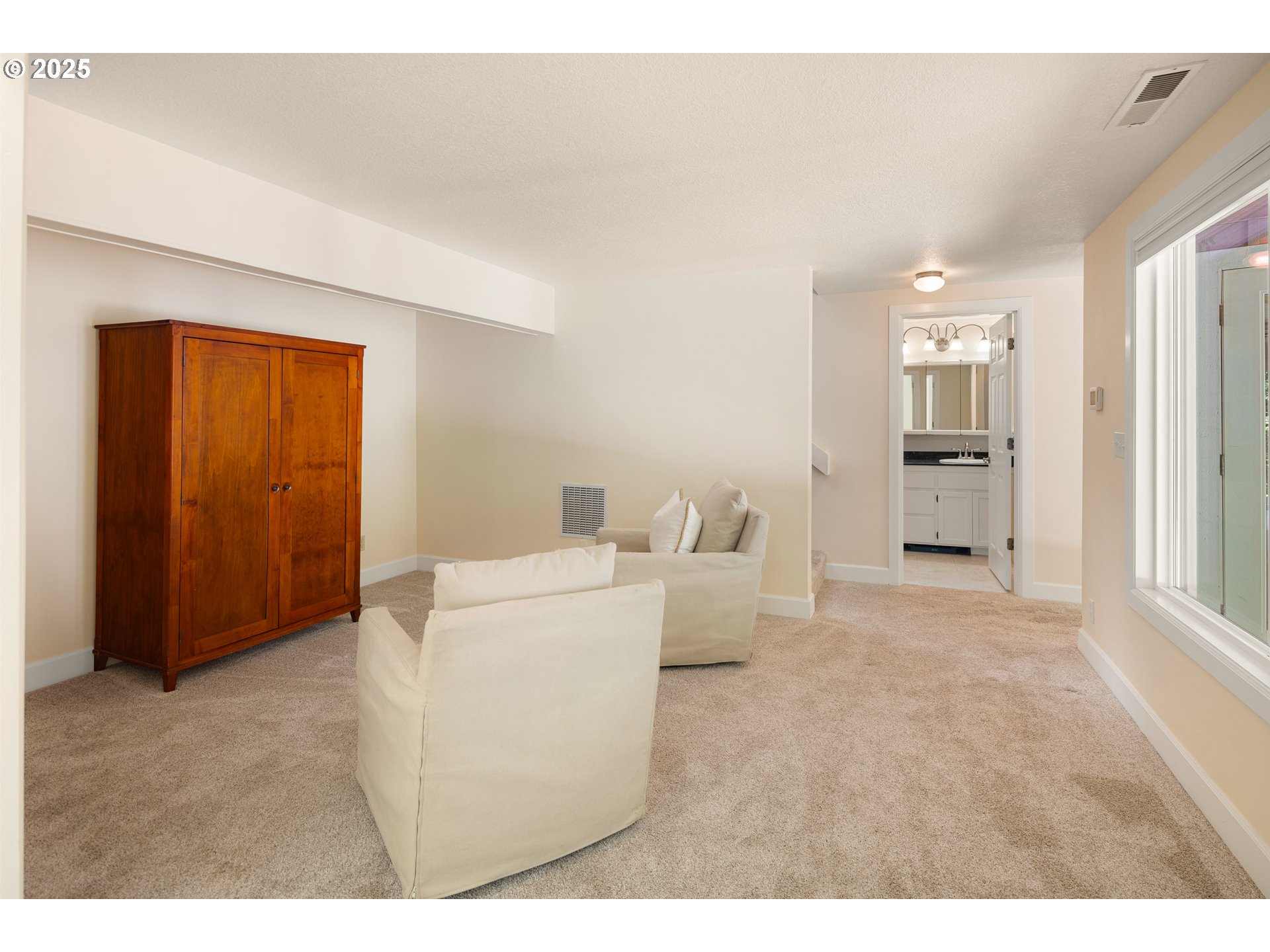 2977 Ingalls Way Eugene, OR 97405 - Photo 31 of 48 a living room with furniture and a refrigerator