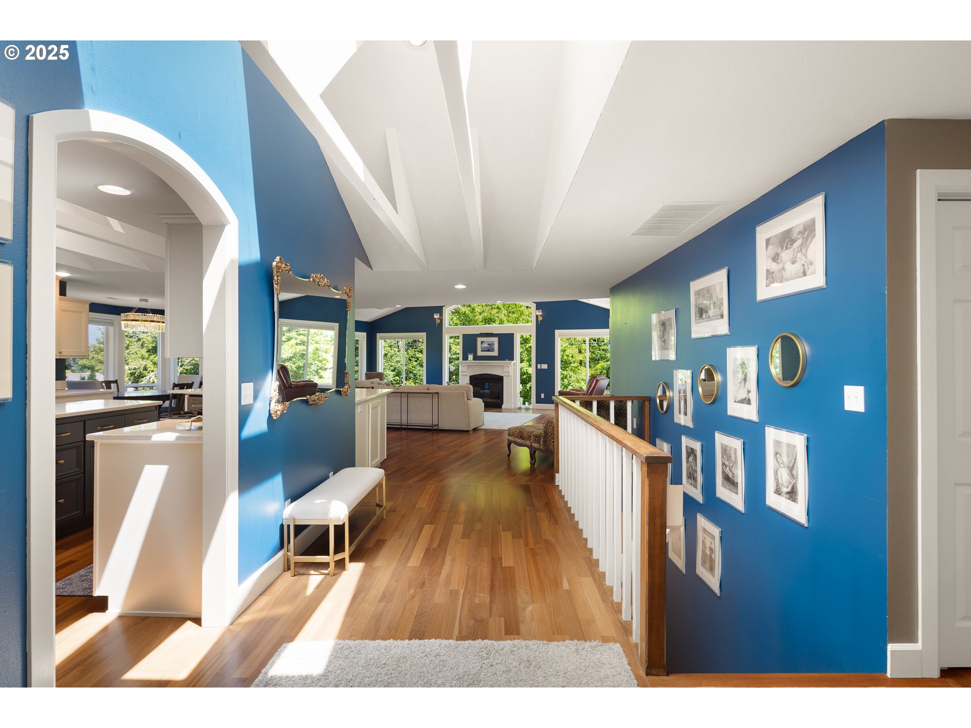 2977 Ingalls Way Eugene, OR 97405 - Photo 4 of 48 a view of a living room and kitchen with furniture wooden floor and a chandelier