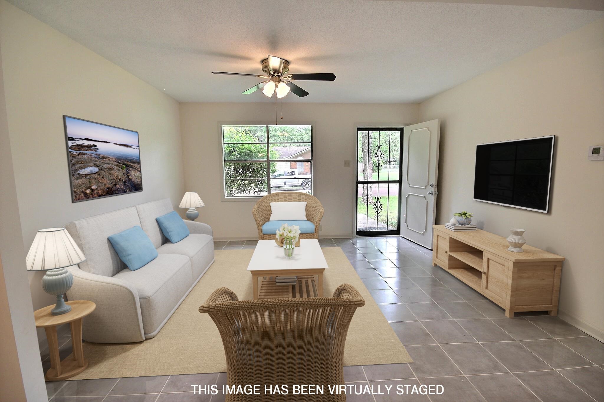 943 Poplar Leaf Road Collierville, TN 38017 - Photo 1 of 17 a living room with furniture and a flat screen tv