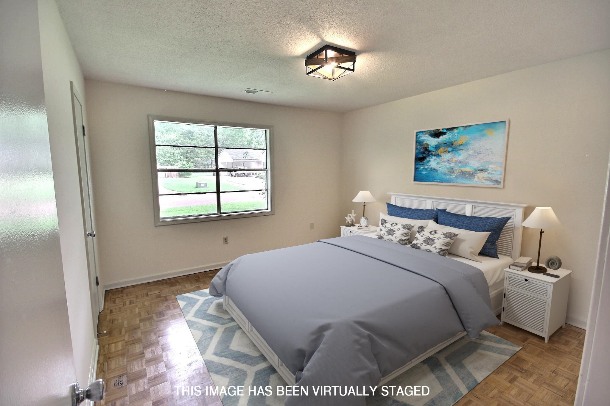 943 Poplar Leaf Road Collierville, TN 38017 - Photo 11 of 17 a bedroom with a bed and a window