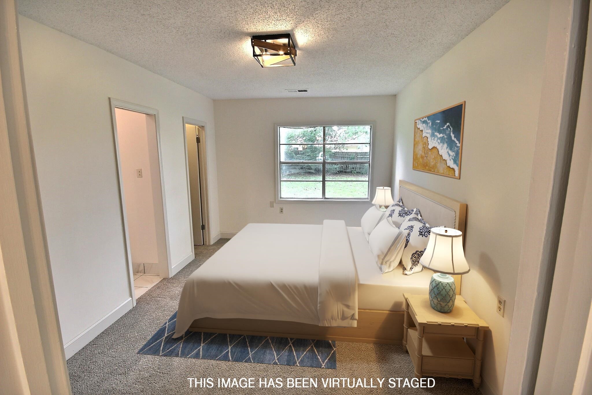 943 Poplar Leaf Road Collierville, TN 38017 - Photo 3 of 17 a bedroom with a bed and a window
