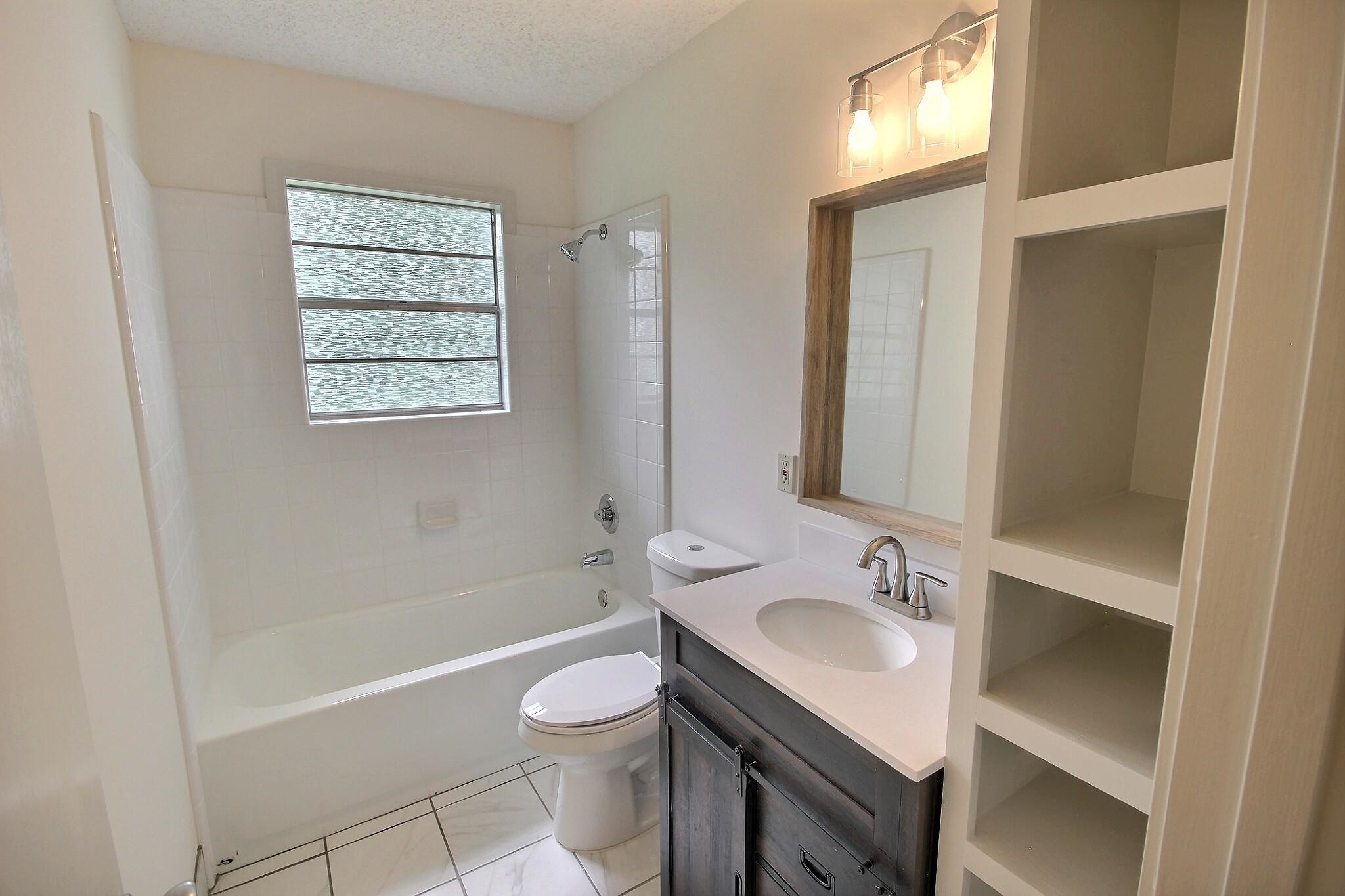 943 Poplar Leaf Road Collierville, TN 38017 - Photo 10 of 17 a bathroom with a sink toilet and shower
