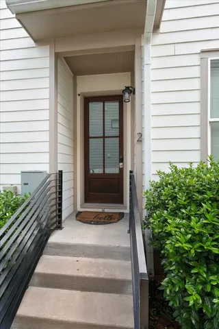 a view of a house with a door and wooden floor