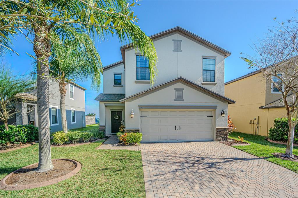 1762 Hadden Hall Place Trinity, FL 34655 - Photo 1 of 39 a view of a house with a yard and plants