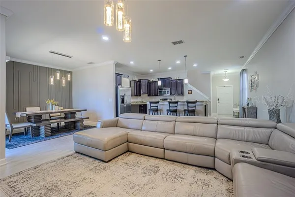 a view of a hallway with wooden floor and entryway